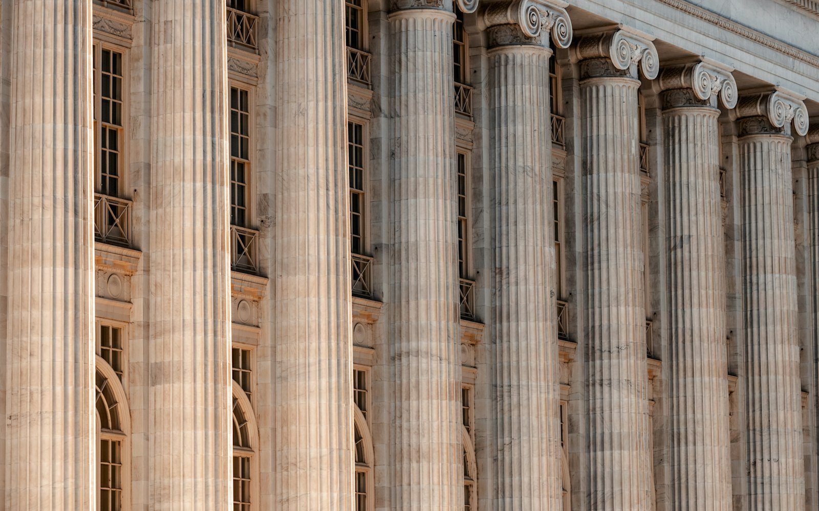 Row of tall stone columns on a court building