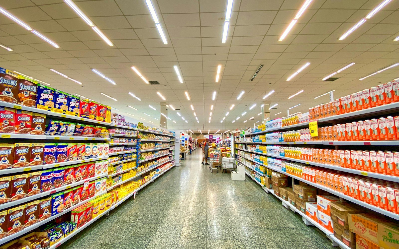 Long aisle of shelves in a retail store