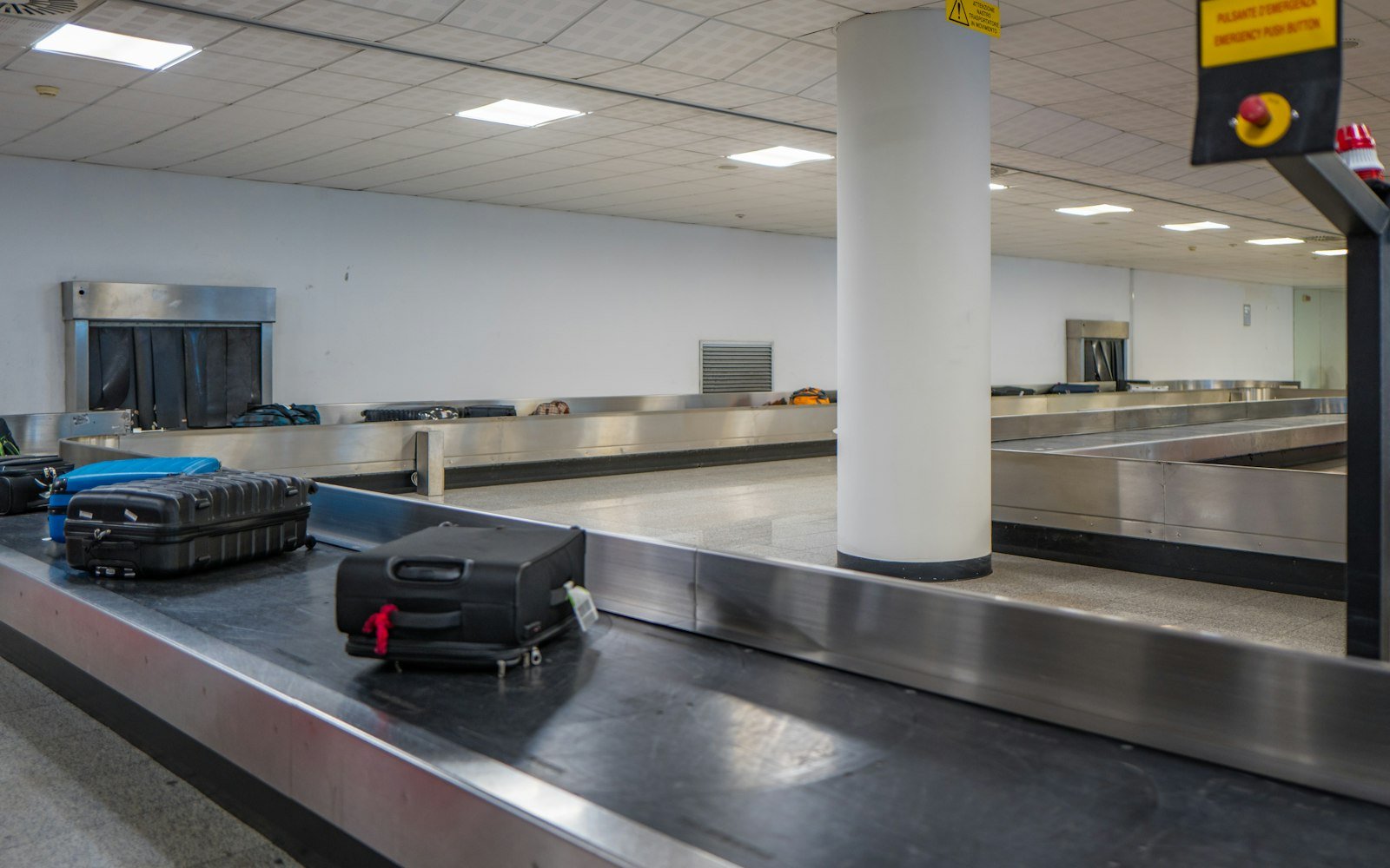 Luggage on a baggage claim conveyor at an airport