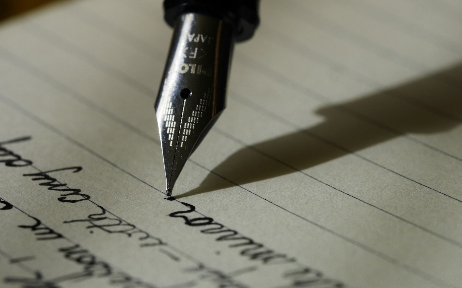 Fountain pen writing on lined paper